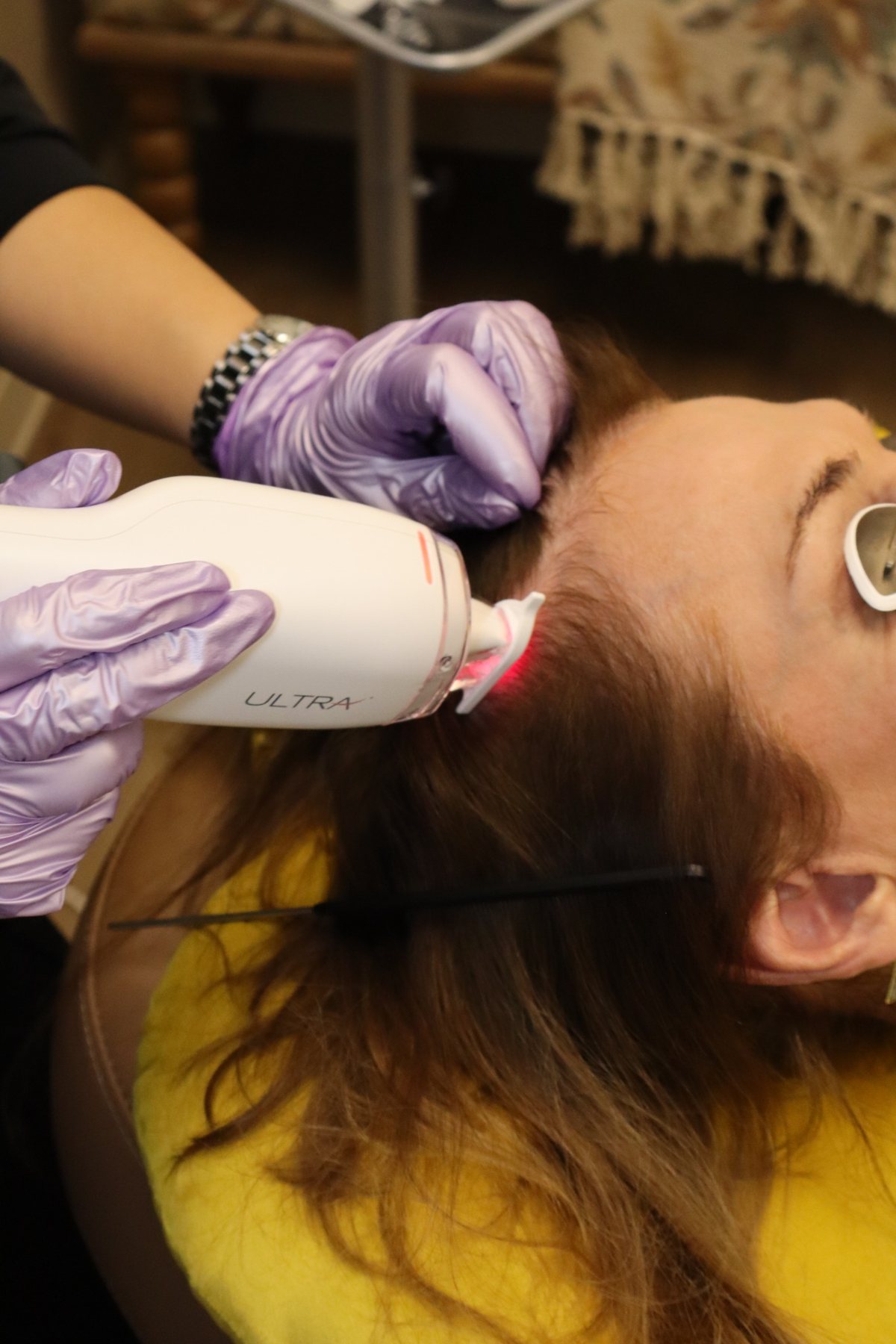 Close-up of the Ultra laser handpiece during treatment